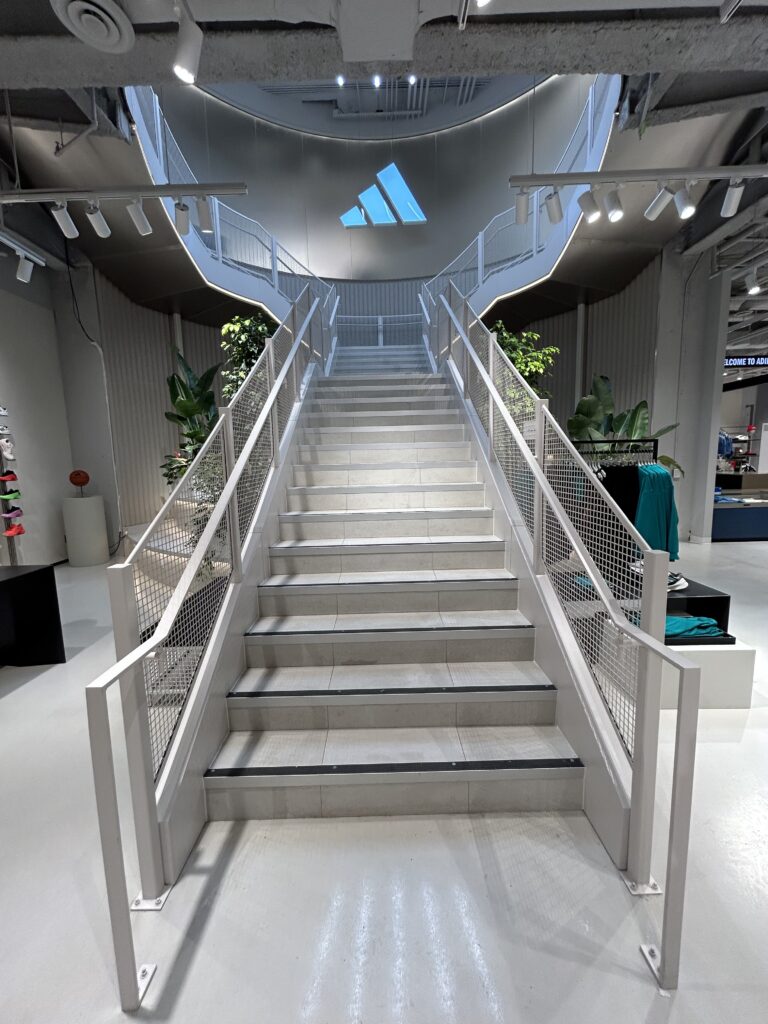 Staircase at adidas Robson store Vancouver | QTC Retail Solutions