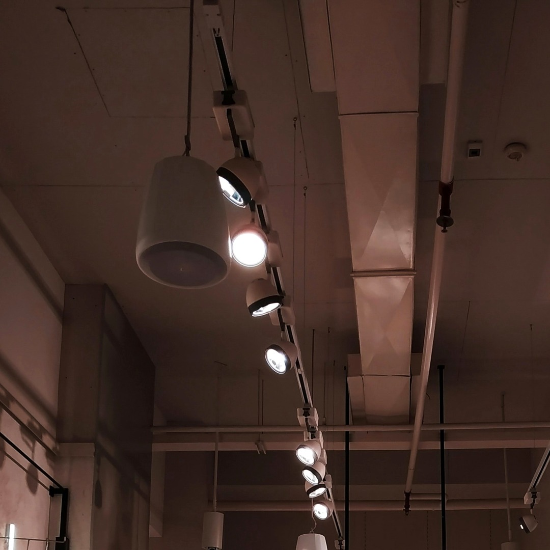 Image of track lighting from a retail ceiling | QTC Retail Solutions